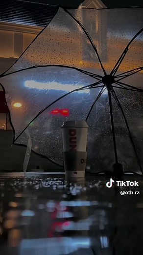 Rainy Night Coffee Moments Under a Transparent Umbrella
