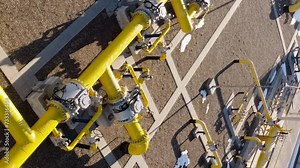 Aerial top view intertwined yellow pipes showcasing engineering marvel Complex intertwining engineering design functionality benefits this engineering marvel. Engineering marvel in all its beauty.