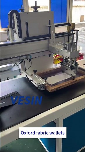 High-speed screen printing machine for Oxford fabric wallets! Perfect for mass production.