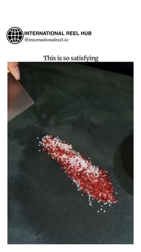 🌍 INTERNATIONAL REEL HUB on Instagram: "The video depicts a jeweler sifting ruby or garnet beads from white cerium oxide polishing compound using a fine mesh sieve, a standard technique to recycle the costly abrasive material while cleaning gems for jewelry assembly. Posted by @DOGE__news , a culture and politics account, the clip taps into the ASMR "oddly satisfying" genre, amassing nearly 1 million views and 940 likes within hours by showcasing precise, repetitive motions that evoke calm and 