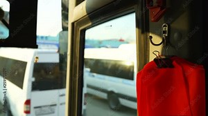 Looking out the window of intercity bus departing from bus station