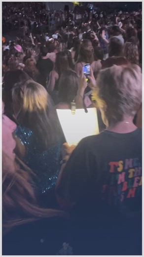 8.5K views · 66 reactions | A woman attending Taylor Swift’s Eras Tour brought a packet of lyrics, complete with a reading light, to sing along during the show! | storyful | Facebook