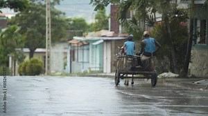 rainy vehicles at Cuba urban streets, people with transportation ,wet roads