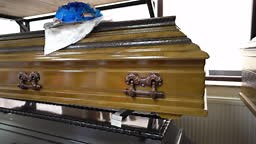 Shop selling coffins and funeral wreaths. Sale of funeral accessories.