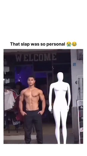 Explore World on Instagram: "The post features a 32-second viral video from a gym event where a shirtless, muscular man posing motionless next to mannequins gets unexpectedly slapped by a woman who mistakes him for a display figure, eliciting a shocked reaction that has garnered over 6.9 million views and 19,000 likes. Reactions highlight the humor in the prank's surprise element, with users like @melorajayne noting the slapper "definitely thought he was fake," amplifying its shareability throug