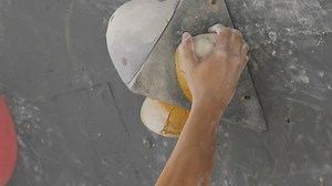 Close up tracking view of a man climbing a wall - Free Stock Video