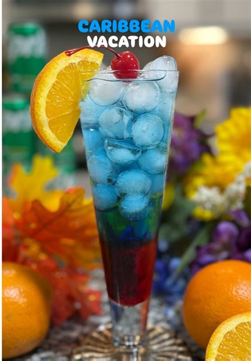 Sipping on island vibes with my Caribbean Vacation Cocktail—sweet, fizzy, and giving tropical getaway energy in every sip. One look at this colorful drink and you’ll feel like you’re lounging on a beach somewhere warm. Who else needs a mini vacation in a glass? ☀️🏝️✨ Recipe 🍹 Ingredients: \t•\tIce 🧊 \t•\t1 oz grenadine 🍒 \t•\t3 oz Sprite 🥤 \t•\t1 oz blue curaçao 🔵 \t•\tOrange wedge 🍊 (for garnish) \t•\tCherry 🍒 (for garnish) Instructions: \t1.\tFill a glass with ice. 🧊 \t2.\tPour in 1 o