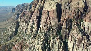 An aerial view shows a beautiful mountain landscape that rises from the desert surrounding Las Vegas, Nevada. This rugged desert area averages over 95 degrees F during summer months.