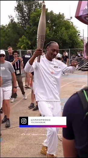 The Dogg Father brings the flame 🔥 #Paris2024