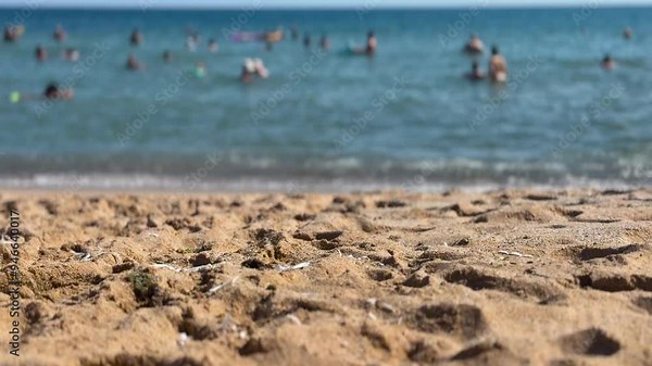 Blurred, defocused panoramic view of sand beach. The beach is focused like a scene, a crowded beach scene video. Type C.