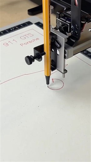 A pen plotter drawing a Porsche, line by line. Every curve captured with precision. Not printed—drawn. Know a car enthusiast? Send them this. | Drawscape