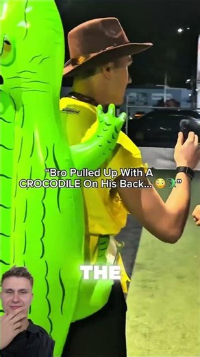 The dude literally has a crocodile on his back. How does this happen? ￼