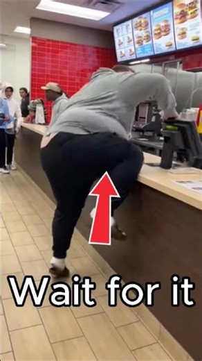 Angry Customer Tries to Climb Fast-Food Counter… Gravity Says No
