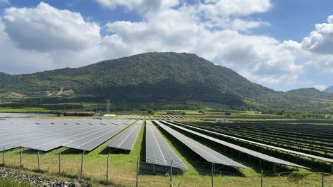 clip-3990514719-wide-view-solar-panel-arrays-covering-open