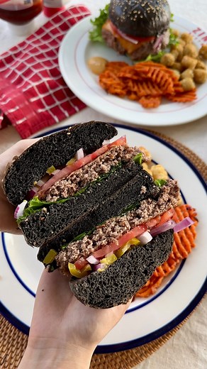 Kim on Instagram: "Black squid ink burger buns 🦑🍔 Bored of regular burger buns? Make these cool mysterious looking hamburger buns instead! Recipe makes 6x4.5” burger buns perfect for 8oz burger patties. Main Dough: 420g bread flour 80g whole milk 10g squid ink 35g granulated sugar 8g salt 6g yeast 2 eggs 70g butter (room temp) Tangzhong: 30g flour 150g milk + sesame seeds for topping 1. Make the tangzhong. Whisk all tangzhong ingredients in a small pot until no lumps remain. Then stir continuo