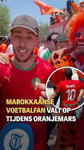 Moroccan soccer fan stands out during Oranje march