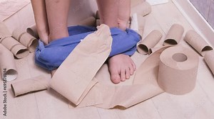 child, boy sitting on the toilet with toilet paper and suffering from constipation, diarrhea, stomach ache or cramps, Hygiene, health care concept