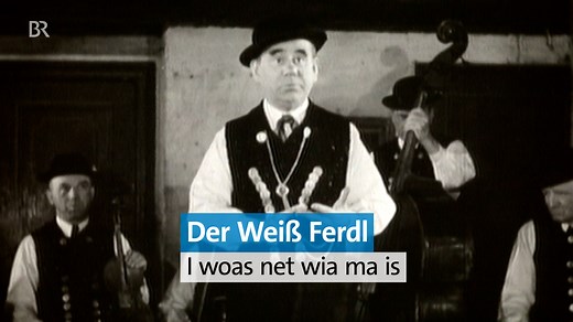 Der "Wagen von der Linie 8" war der größte Erfolg von Weiß Ferdl - und eine Hymne auf München. 🎶 Eigentlich hieß er Ferdinand Weisheitinger, aber Weisheit konnte man dem beliebten Volkssänger nicht unterstellen, dafür Bauernschläue und Talent genug, um sich als Attraktion im Münchner Platzl durch Monarchie, Republik und Nazizeit zu lavieren. 😇 ▶️ Die ganze BR-Doku "Der Weiß Ferdl - I woas net wia ma is" jetzt in der BR Mediathek anschauen: https://www.br.de/mediathek/video/der-weiss-ferdl-doku