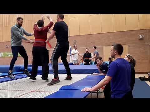 Backward Somersault Support practice using two coaching belts