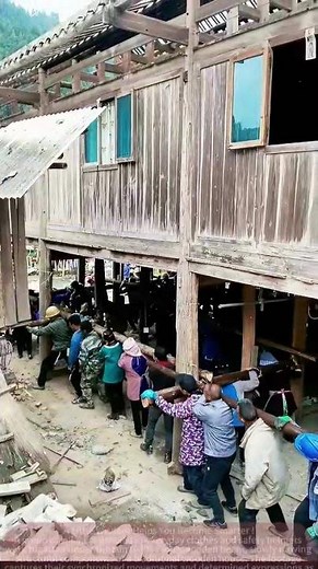 Traditional Wooden House Relocation: Collective Effort to Lift Beams, Stunning Scene!