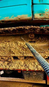 Ac washing some very muddy digger tracks | Aqua Cleanse