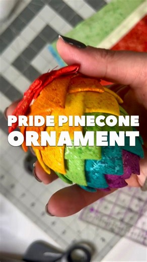 Making a little Pride pinecone ornament because queer joy is year-round in this house. 🌈✨ These are way easier than they look - just folded fabric, appliqué pins, and a little patience. I also just restocked the Glisten rolls (aka the perfect rainbow for this project) and the appliqué pins I’m using here. And reminder: my Notions & Patterns Sale runs through Sunday, so go save a little coin while you’re feeling crafty. 🧵💅 Let me know if you make one - they’re addictive. | Mx Domestic