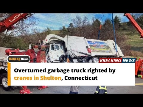 Overturned garbage truck righted by cranes in Shelton, Connecticut