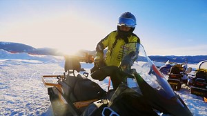Hanat Tursunhan, a snowmobile rider in China's Xinjiang, enjoys taking tourists whizzing on the snowfield. Check out his happy daily life. #GLOBALink | China Xinhua News