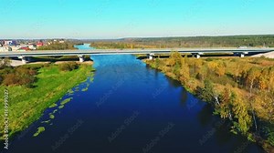 Aerial view highway above beautiful river water. Landscape highway road above river. Car bridge over river landscape aerial. Drone view bridge road above river. Highway bridge aerial view