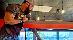 Watch: The skin from a python, caught by Roger Lolly, adorns a wall at Florida Boy Burger