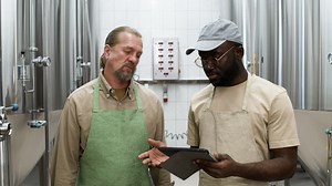 Two men in a factory | Free Stock Video Footage