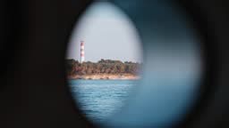 Footage of Ocean view through the cruise ship porthole of a going...