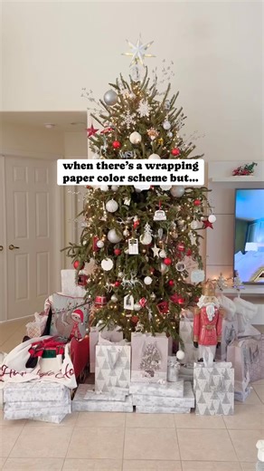 If you’re OCD about your Christmas tree color scheme like me, this is the perfect solution. Every year I build a border wall of my color scheme (always white and silver) and all the multicolor gifts go behind the border. This maintains a cohesive aesthetic for all my photos and videos and allows all guests, husbands, kids to use whatever color bags and wrapping paper they want without ruining the aesthetic 🤣 #holidayhumor #relatable #christmasdecorations #christmasaesthetic | Jessica Alpern