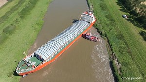 Footage shows cargo ship stuck in river