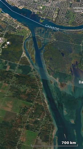 The St. Marys River forms the natural outlet of Lake Superior, flowing southeast to Lake Huron along the international border between Michigan and Ontario. This short but critical waterway connects the largest freshwater lake in the world by surface area to the rest of the Great Lakes system. A significant drop in elevation occurs near Sault Ste. Marie, where rapids once made navigation difficult. To manage this change in elevation, a system of locks allows ships to move between Lake Superior an