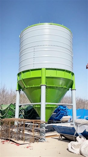 This is a bolted steel silo under construction.