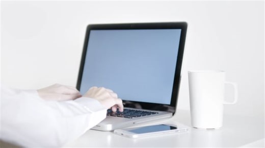 Person Typing on Laptop Computer