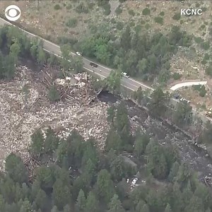 Rain over the burn scar left by the Cameron Peak Fire in Rustic, Colorado caused flash flooding on Tuesday, which damaged structures — including a bridge — and killed at least one person. https://cbsn.ws/36PUJnw | CBS News