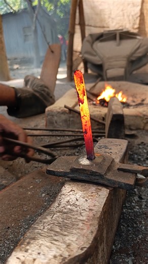 Watch how a blacksmith turns a piece of iron into a nail by hand."