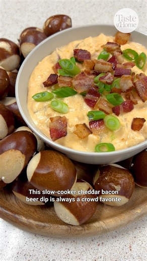 Add bacon and throw it in a slow cooker, and you have an effortless and super dippable game-day snack and pub-style appetizer for any crowd. 🔗 Get the recipe: https://bit.ly/4ppadVz #gamedaysnacks #cheesedip #slowcookerrecipes #appetizers #beercheese | Taste of Home