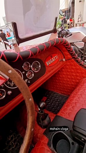 Vintage Red Bugatti Showcased at Luxury Car Event
