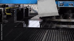 View of work of the automatic machine that processes a steel part in production