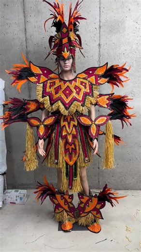 JMK Costuming & Show Design on Instagram: "Next Up In Our “Details In The Fabric” Series, The Male Warrior Suit We Made For The Downtowners NYB, And The 2026 Philadelphia Mummers Parade. A Cranberry Bengaline Fabric Was Used As The Base Fabric. And, It Was Overlaid With A Spotlight Orange Sequin Fabric. Sequins Trim Colors Included Black, And Lime Green Spotlight. Feather Used Was 8” Coque, And 12”/16” Orange, And Cranberry Coque. Thanks For Continuing To Follow Us, As We Bring You More From The