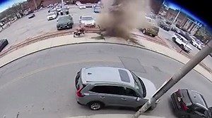 Shocking moment manhole cover explodes nearly taking out woman pushing stroller