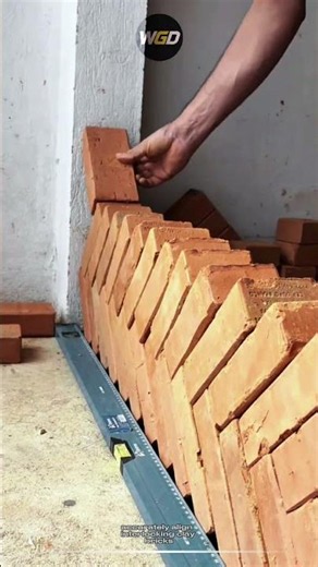 Interlocking brick alignment method enables perfect angled wall construction with precision