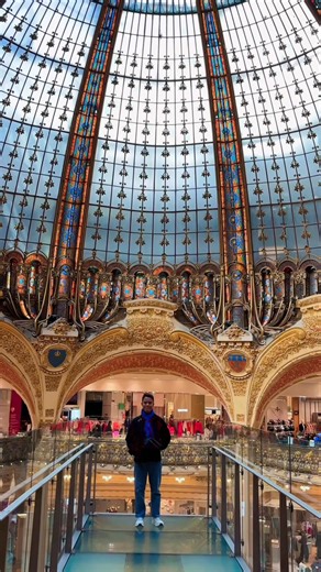 This is Galeries Lafayette, one of the most famous and iconic malls in Paris, known for its stunning Art Nouveau dome and luxury vibe. 💛 It’s just as gorgeous inside! Built in 1912, it’s full of history, art and charm. When you walk in, it feels like stepping right into the heart of Paris. ✨🇫🇷 #Lafayette #Paris | John Paul Santiago