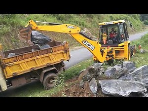 jcb 3dx super loading big stone## outside and inside view ## little boy operating jcb backhoe loader