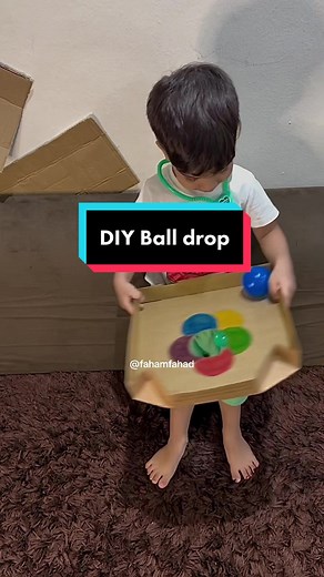 DIY Ball Drop: Fun Toddler Activity Using Recycled Pizza Box