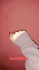 Beautiful Hand Gestures with Red Nails on Pink Background