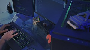 Software developer working on a computer - Free Stock Video